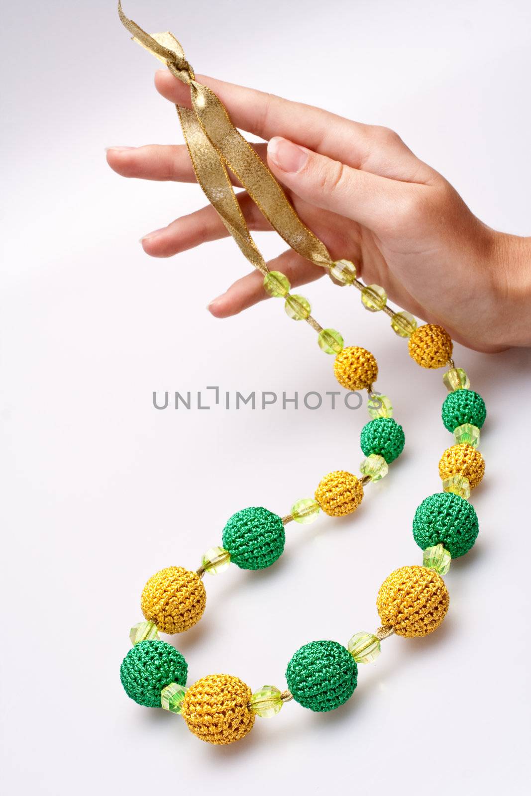 necklace of beads knitted on a white background