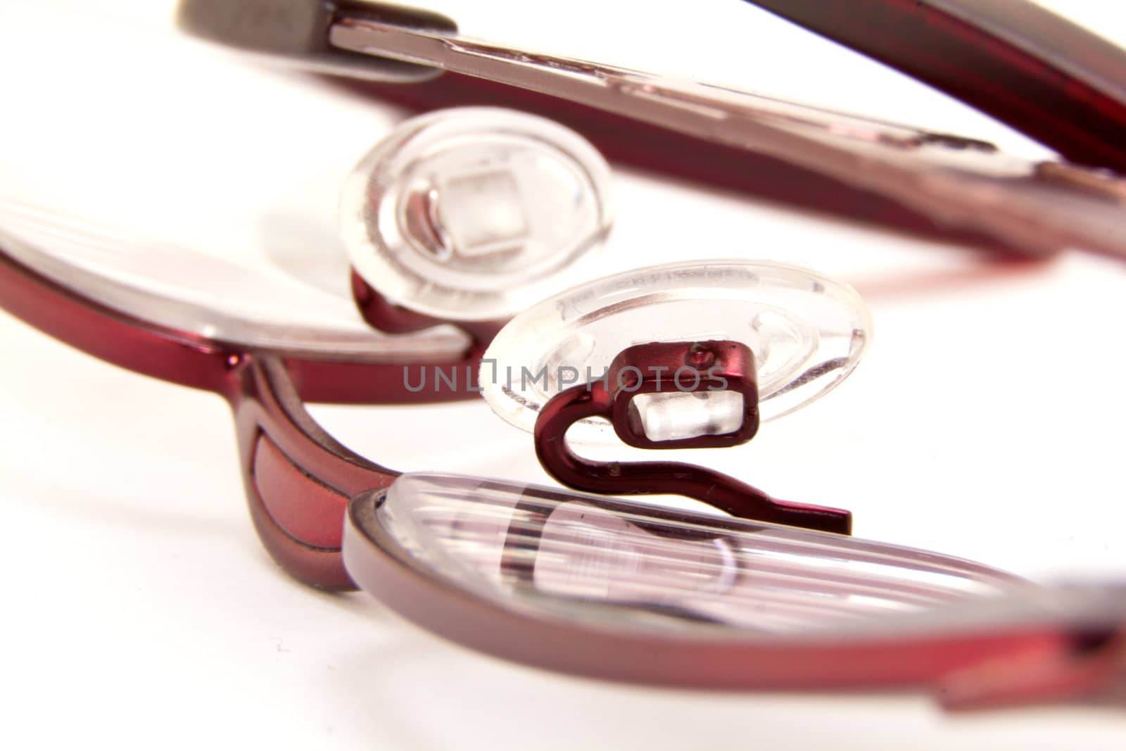 A  pair of  folded eye glasses on a white background