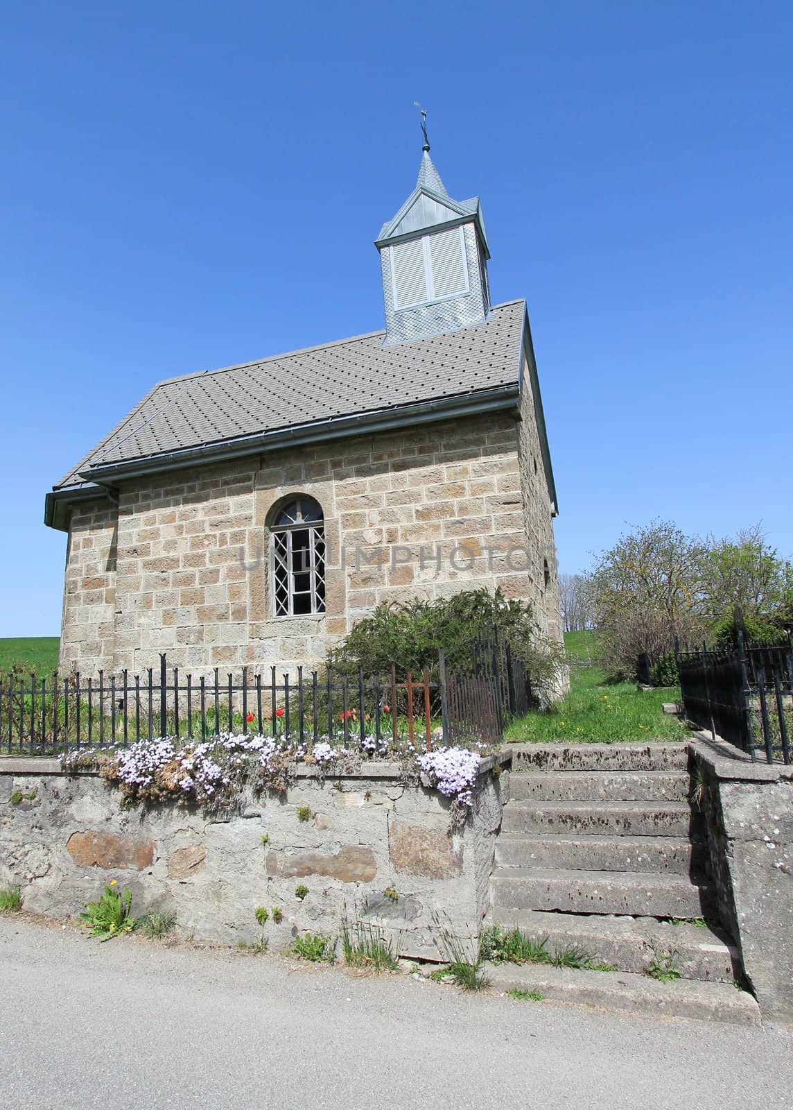 Chapel in Fiaugeres, small village in Fribourg canton, Switzerland, by beautiful weather