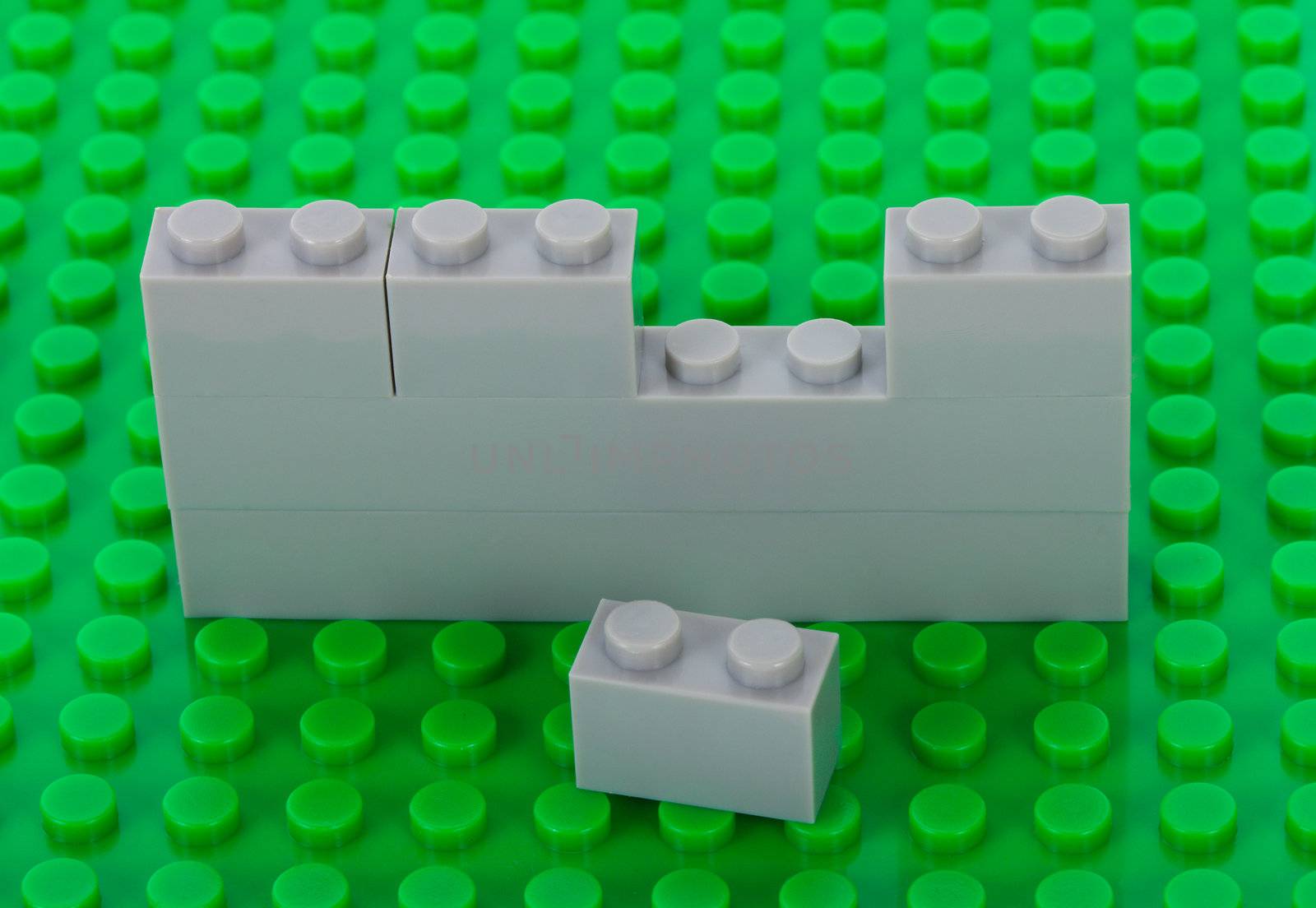 plastic construction background with gray bricks