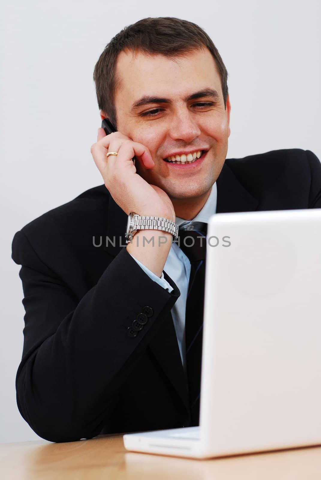 Businessman having telephone conversation by gorgev