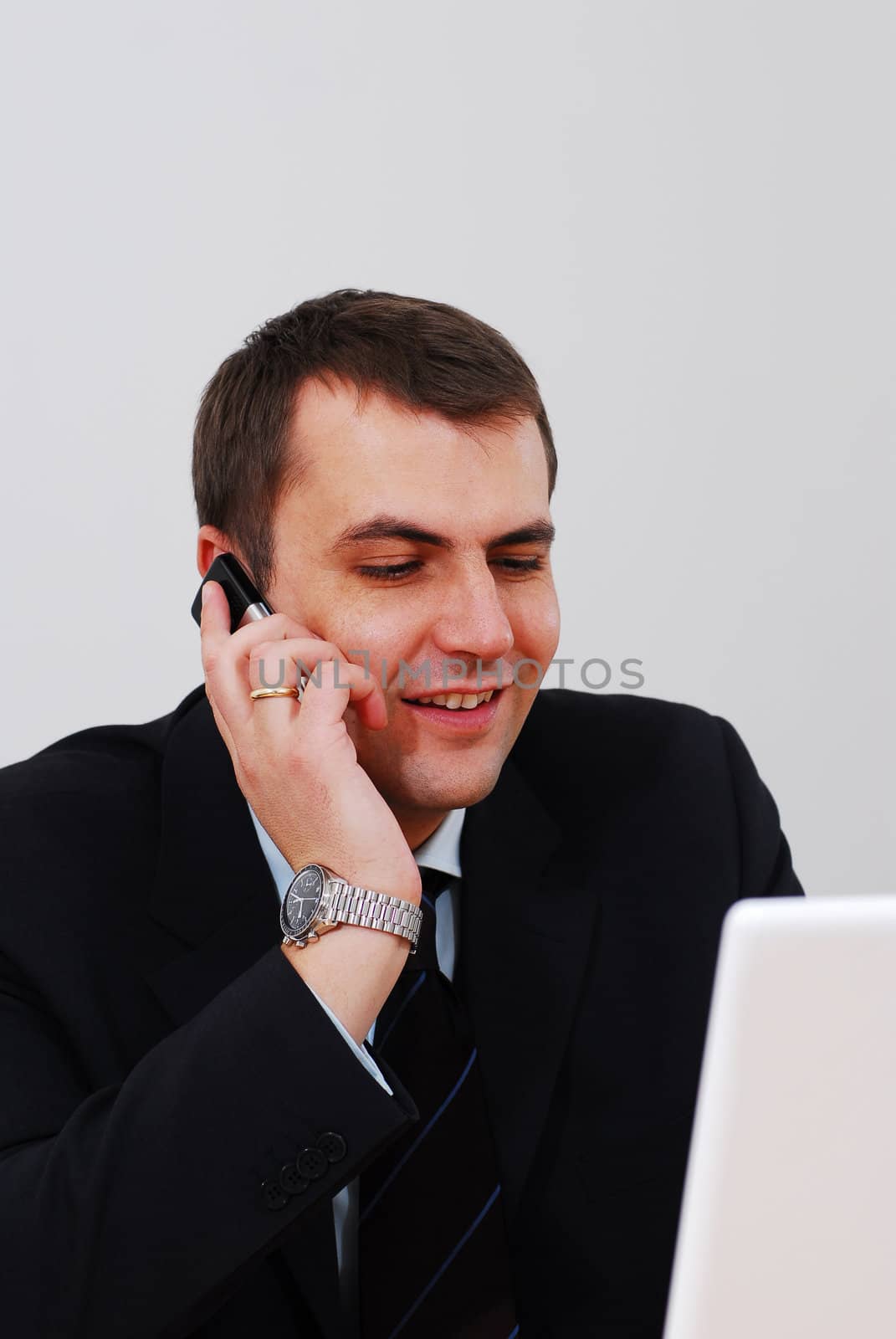 Entrepreneur talking on the phone by gorgev
