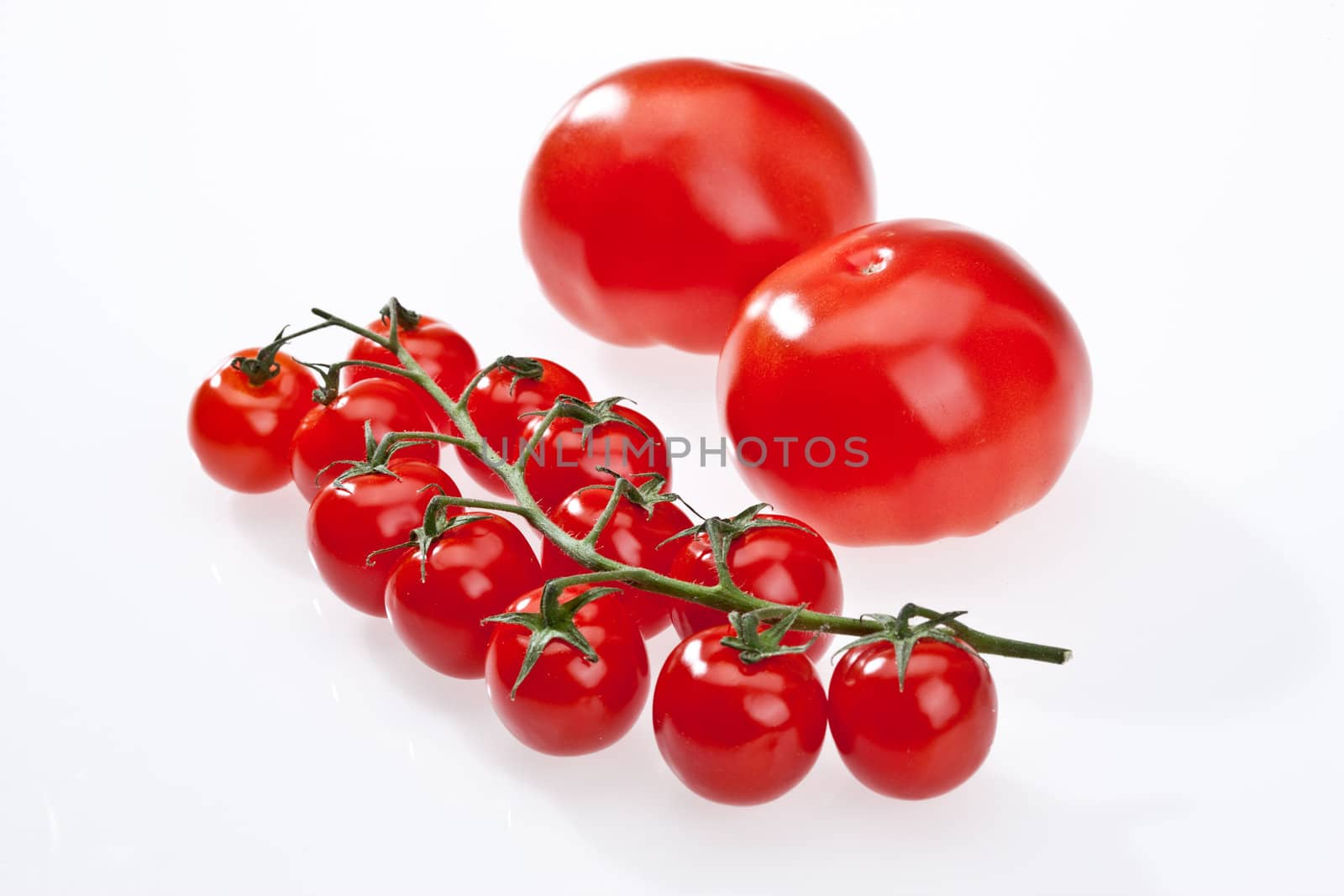 food series: ripe red cherry tomato over white