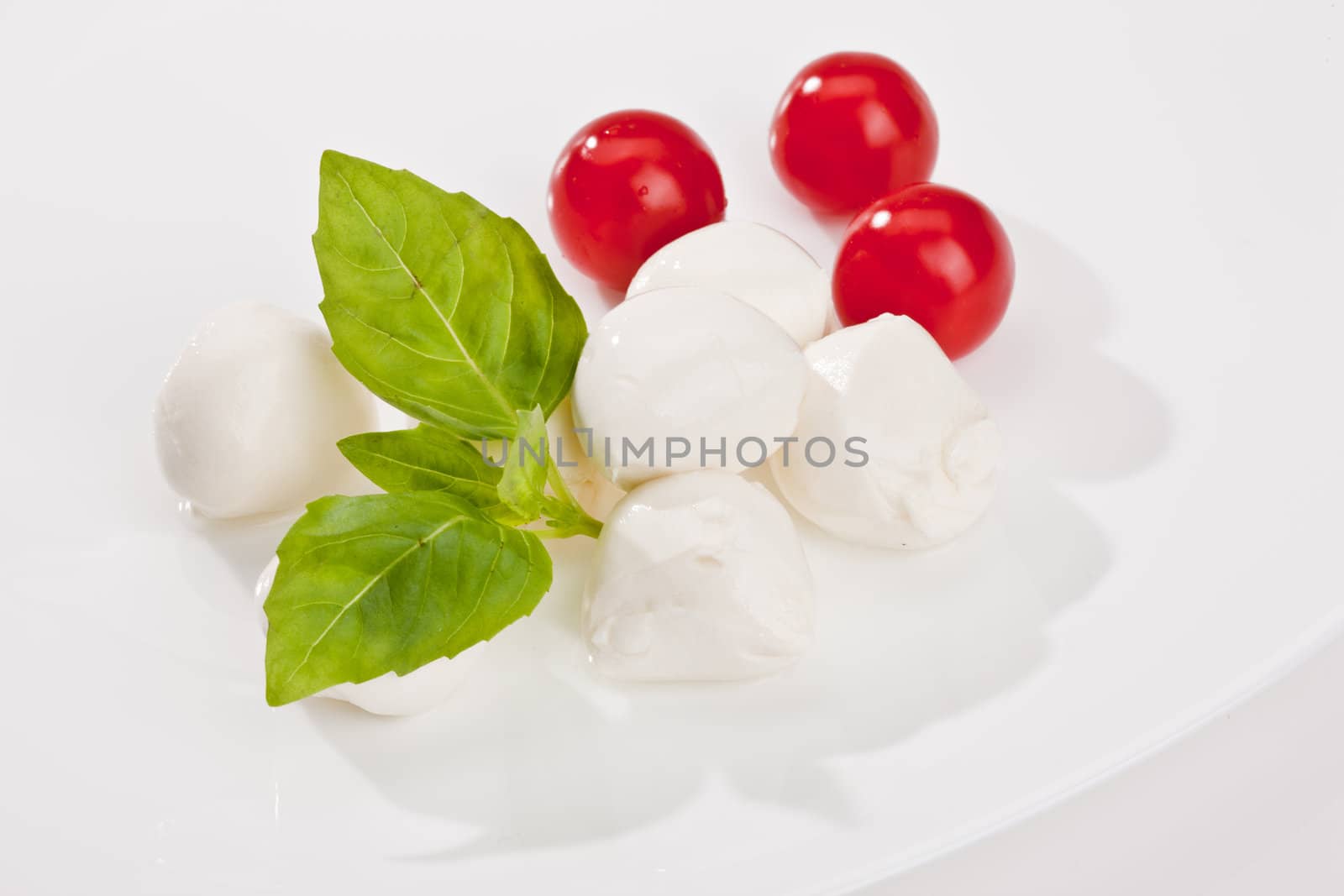 food series: mozzarella, tomato and basil over white