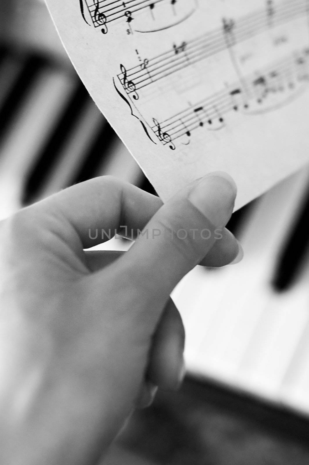 Hand turning music notes by Angel_a