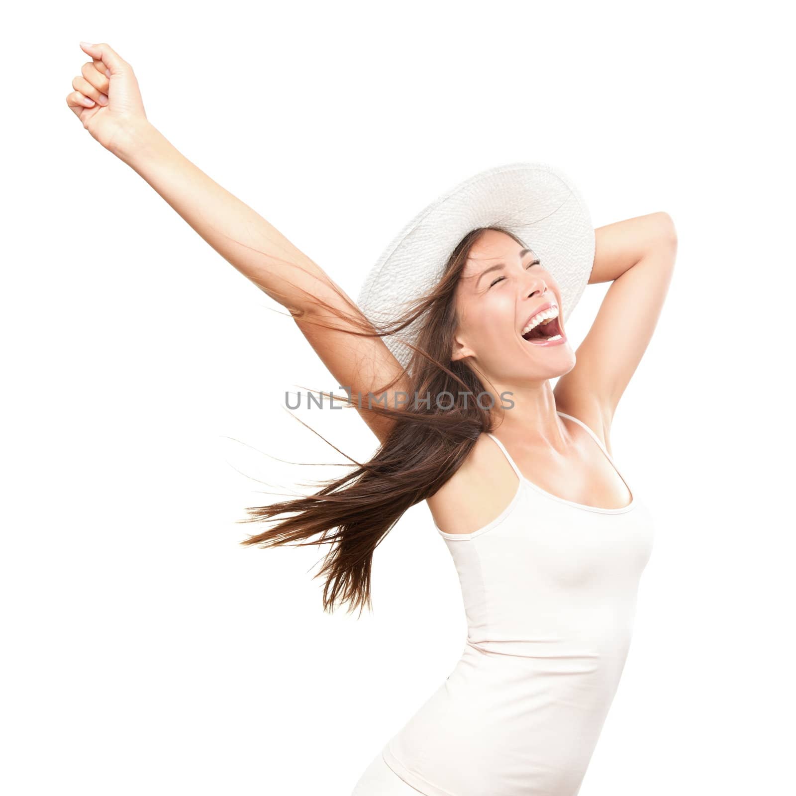 Happiness. Happy summer woman isolated in studio. Energetic fresh portrait of young woman excited cheering in wearing beach hat. Beautiful mixed race Asian Caucasian model isolated on white background.