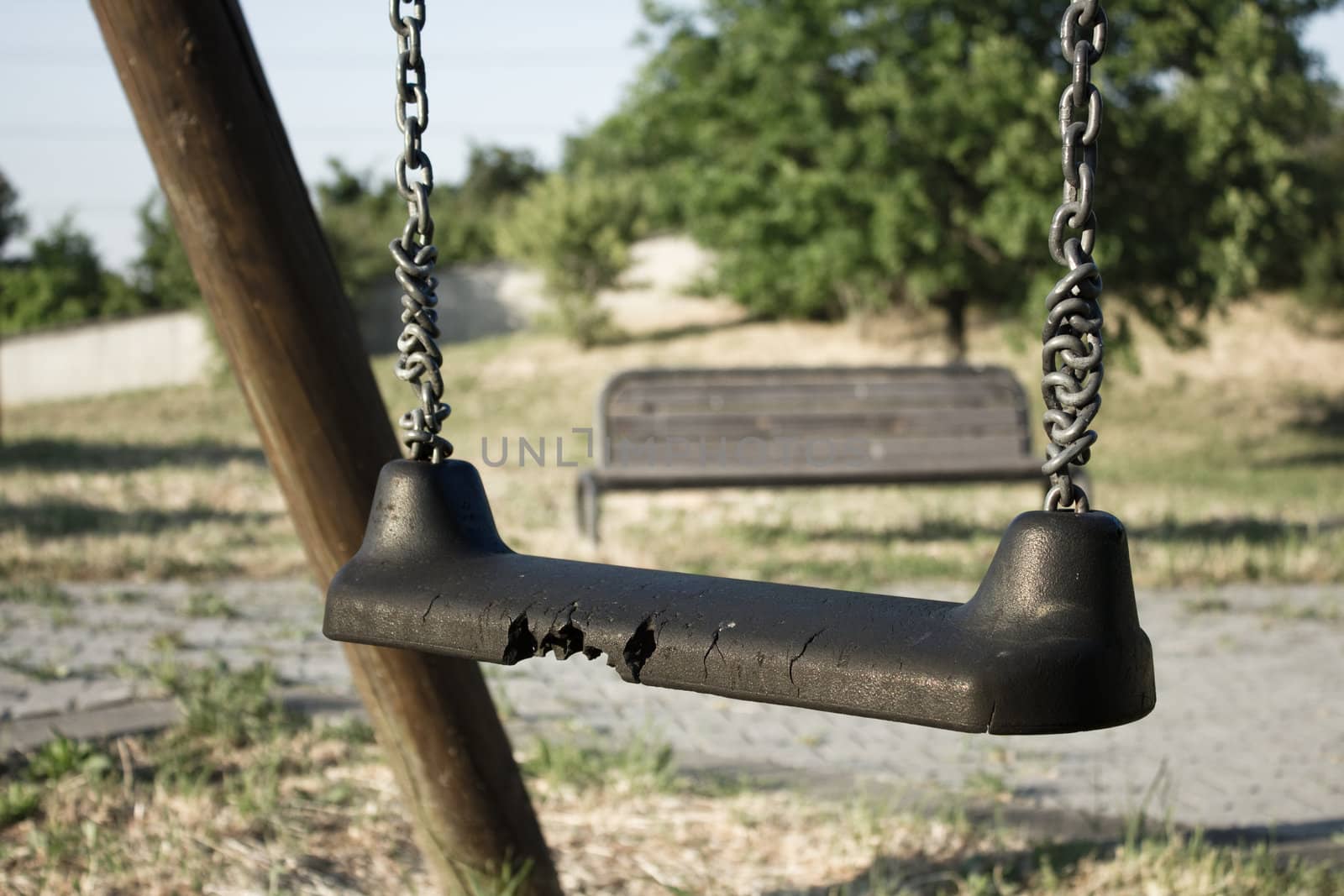 The loneliness and sadness of a childhood denied, represented by a decadent and abandoned playground