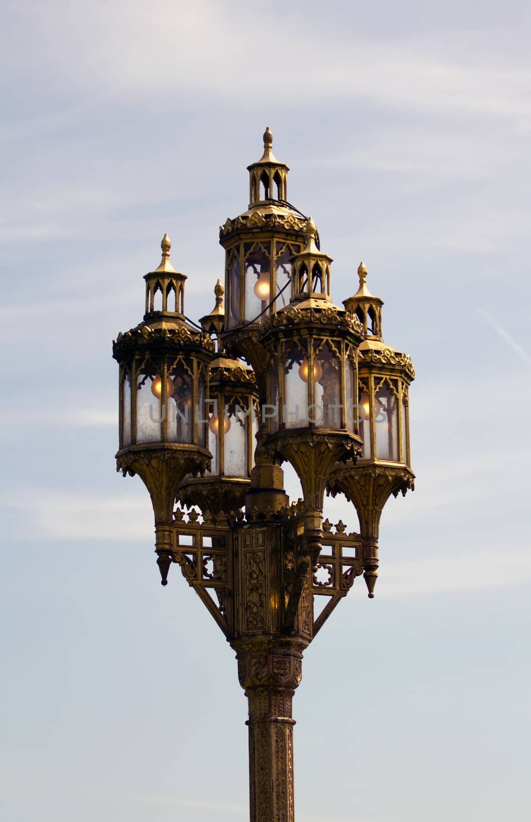 A Gas Street Lamp stands against the warm summer sky