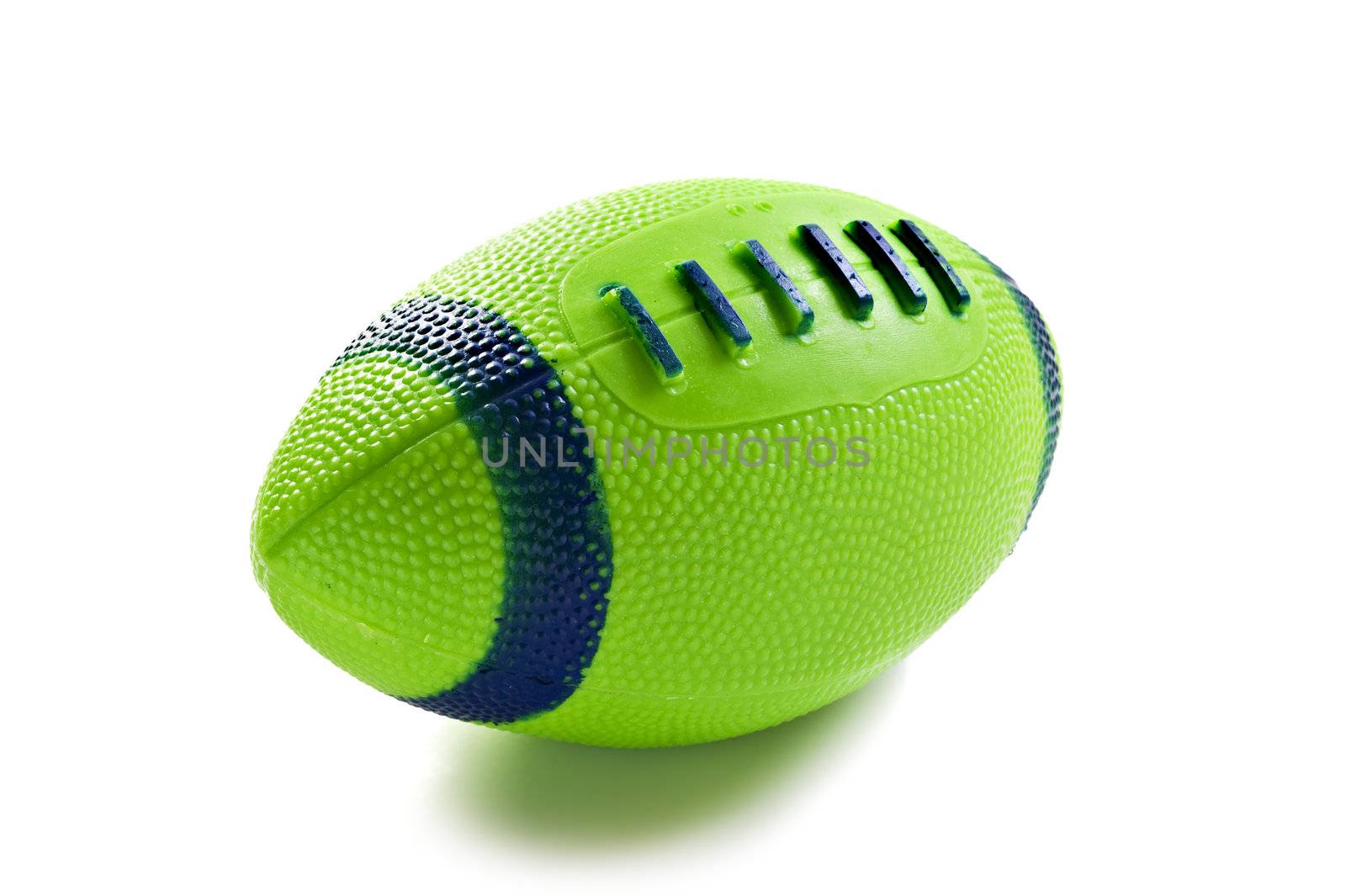 Green toy rugby ball isolated on white