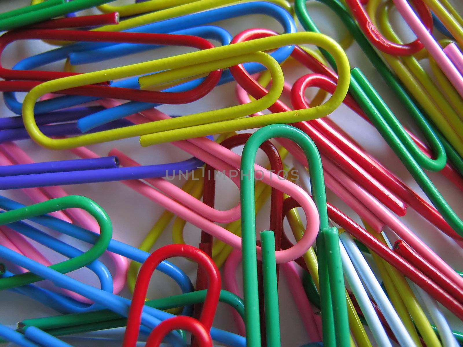 A photograph of plastic coated paper clips.