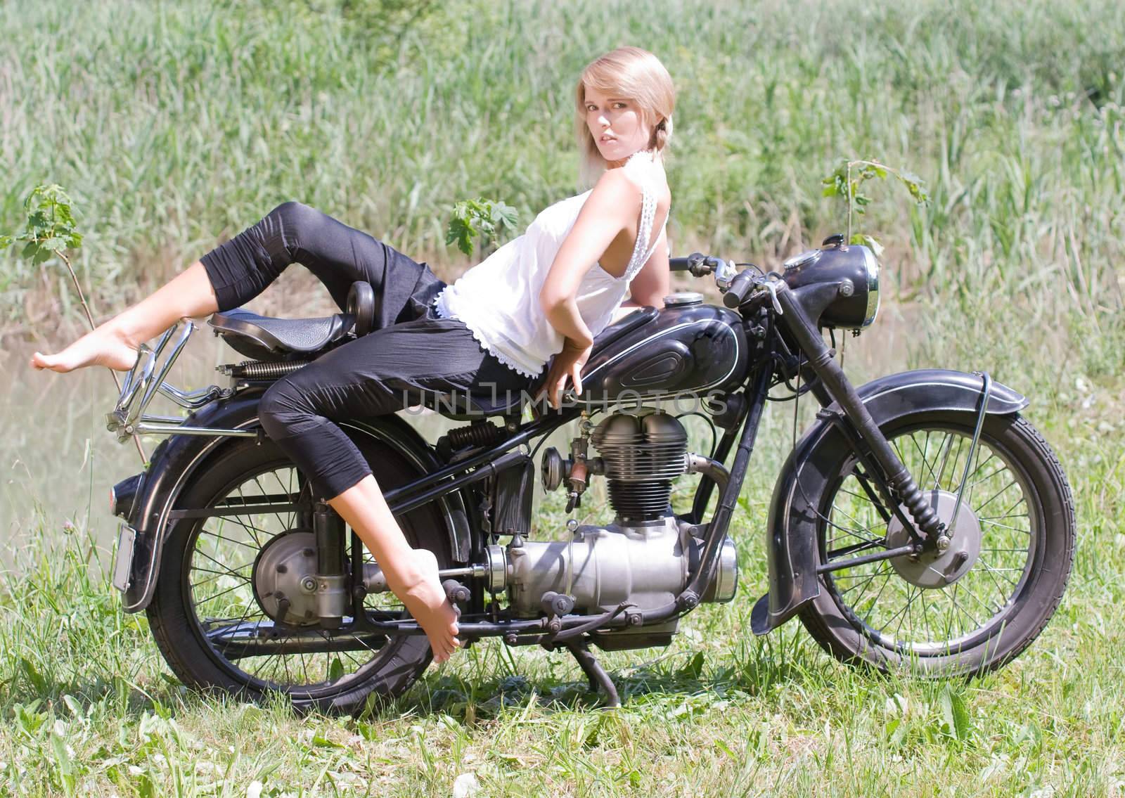 Young woman on motorcycle by STphotography