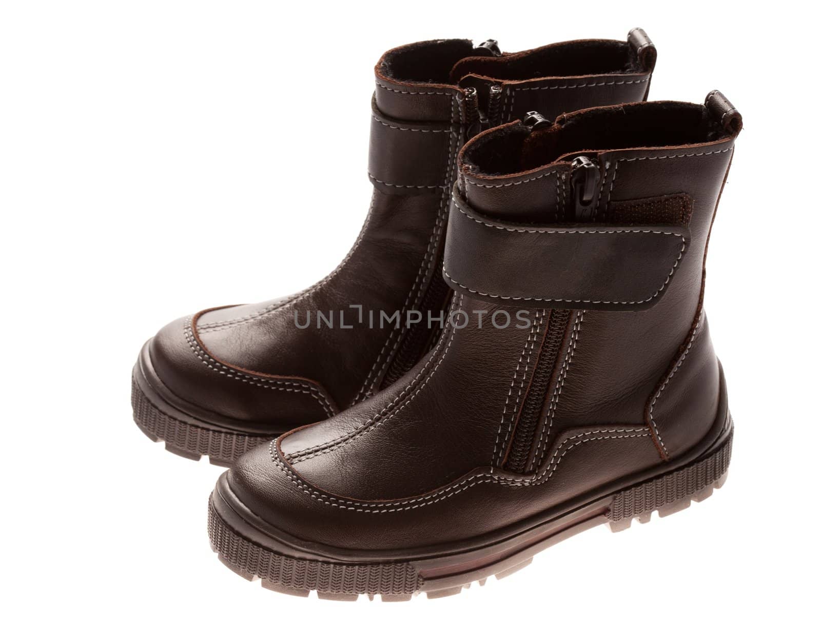Children's winter leather shoes isolated on white background