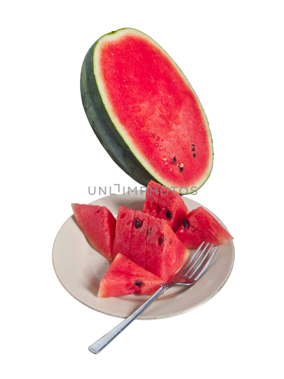 Pieces of fresh watermelon in dish with fork ready to eat