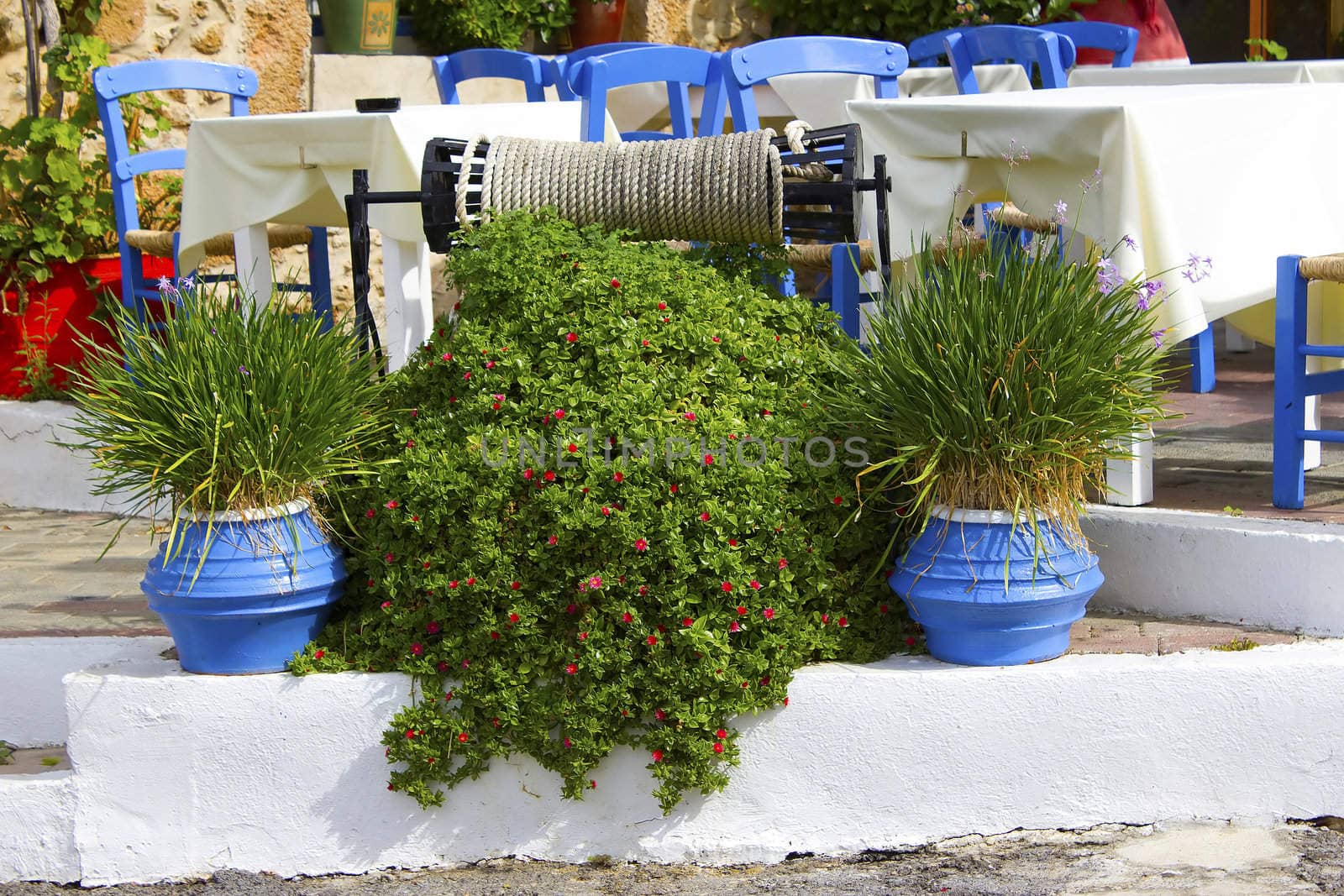 Tables on the street outside Taverna in Malia, Crete