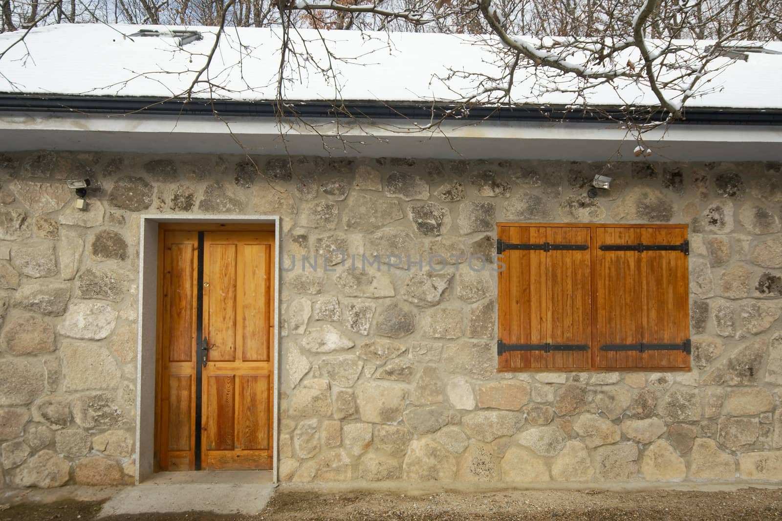 facade of small housa at winter