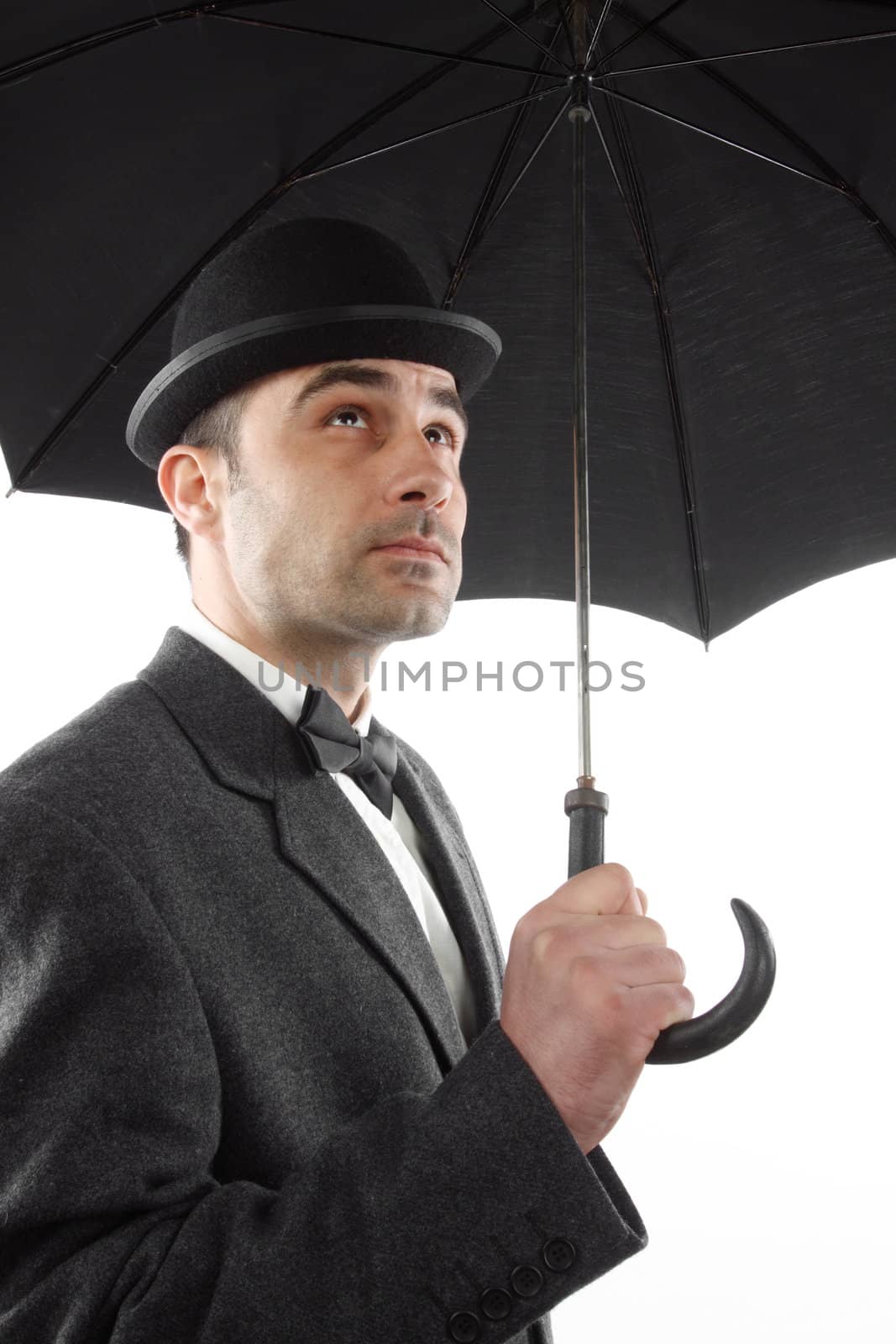 man with bowler hat and an umbrella 