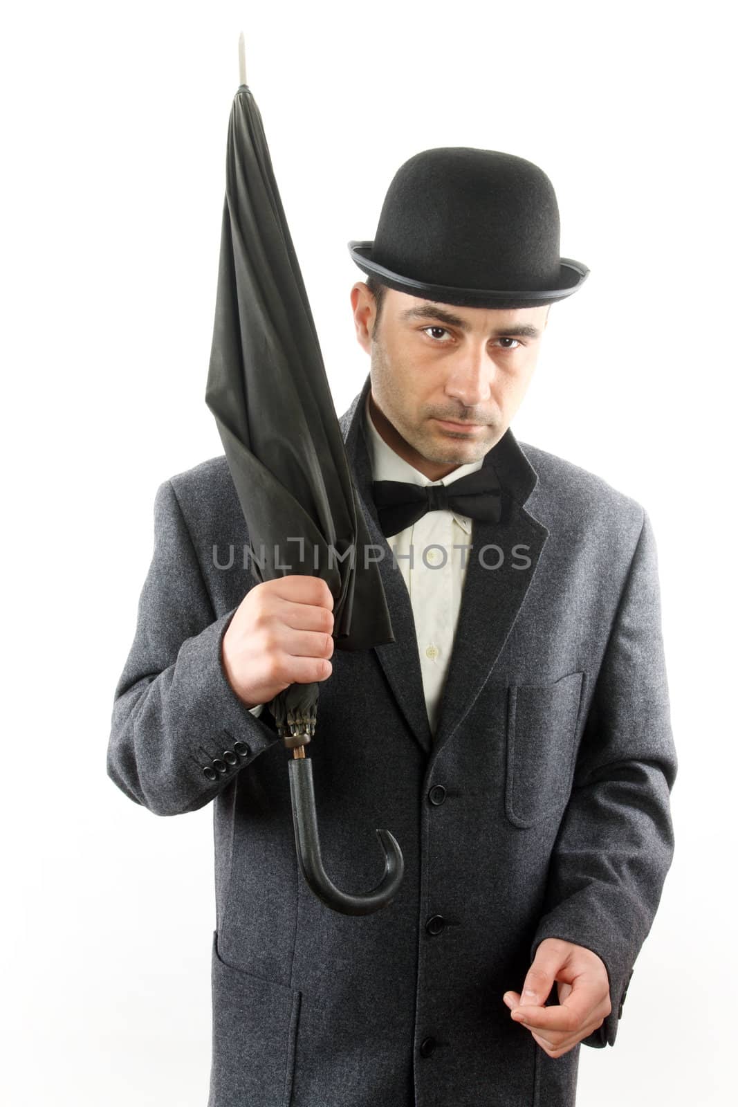 man with bowler hat and an umbrella