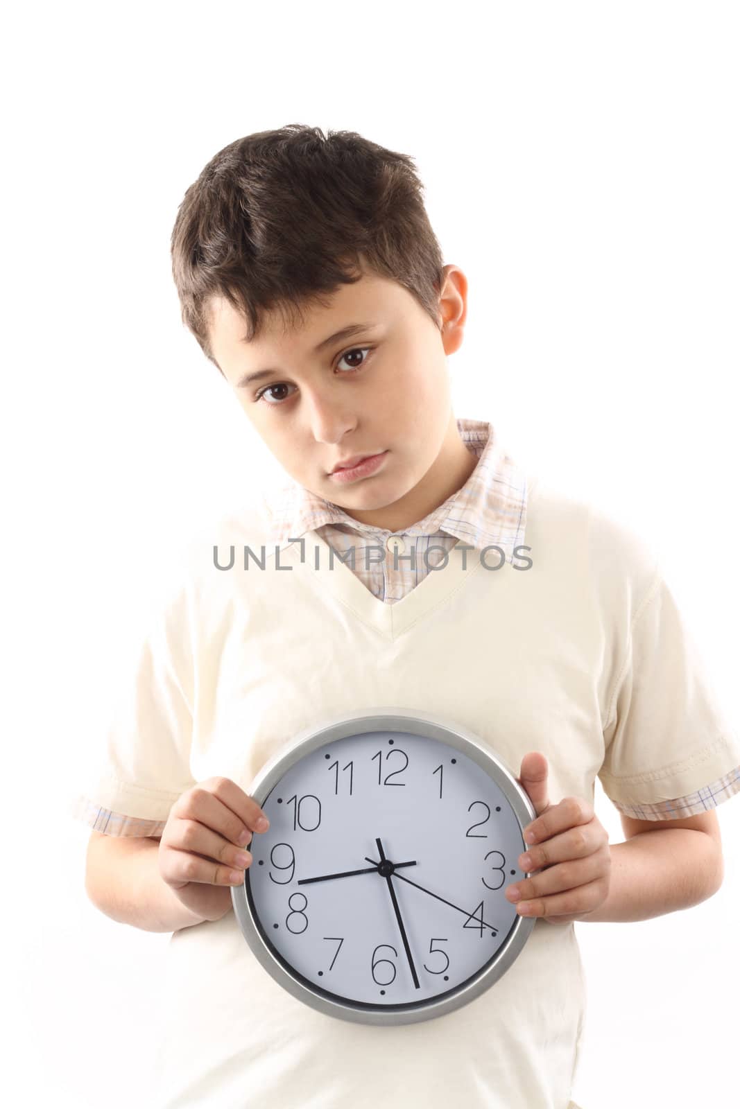 Portrait of a kid with clock. Time to school concept