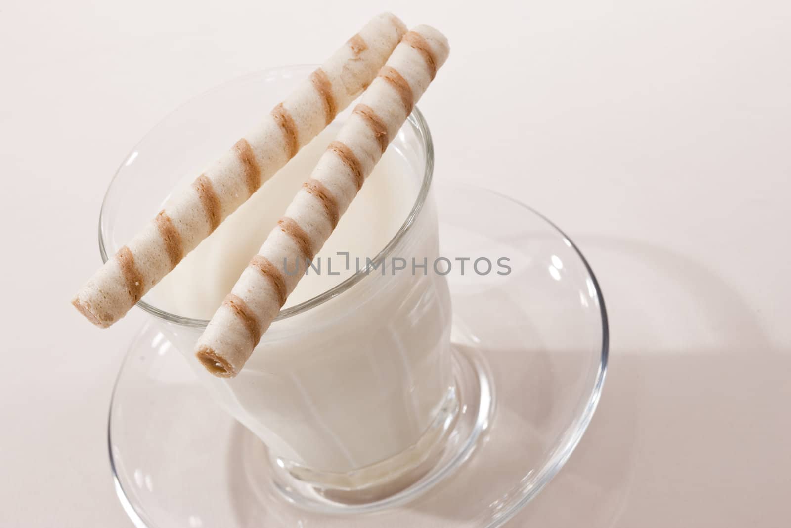 food series: glass with milk and pstry on white