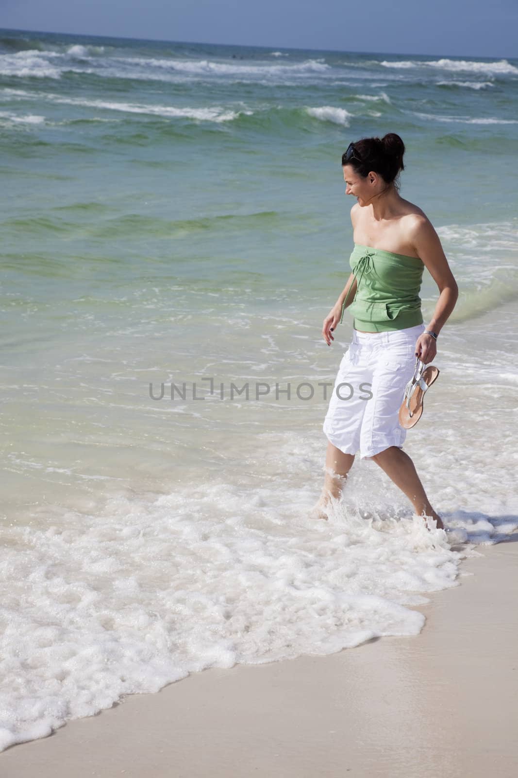 Girl having fun on the beach by benkrut