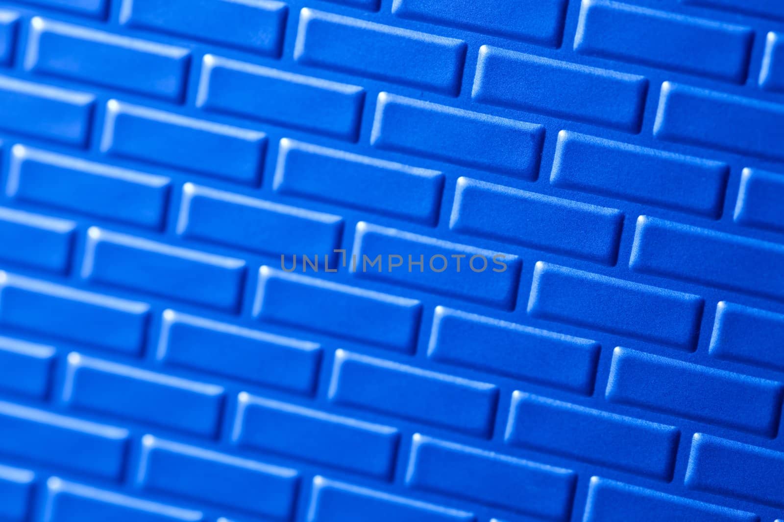 A wall formed by metal bricks