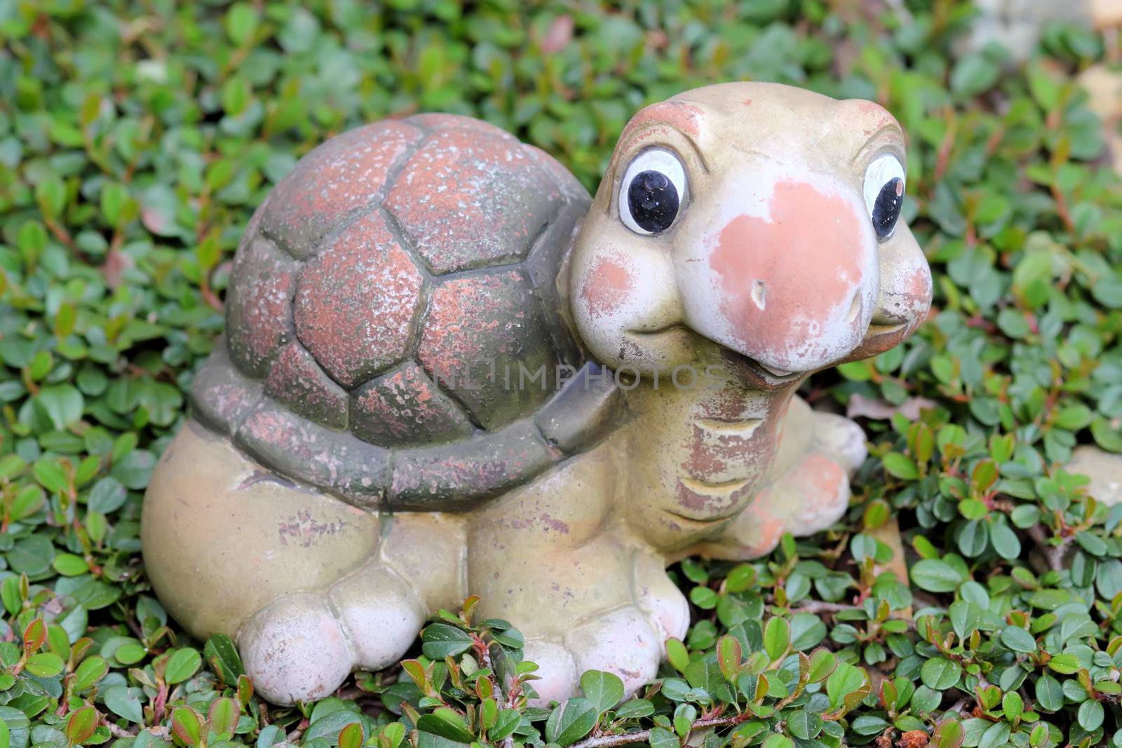 Nice decorative turtle figurine in spring garden