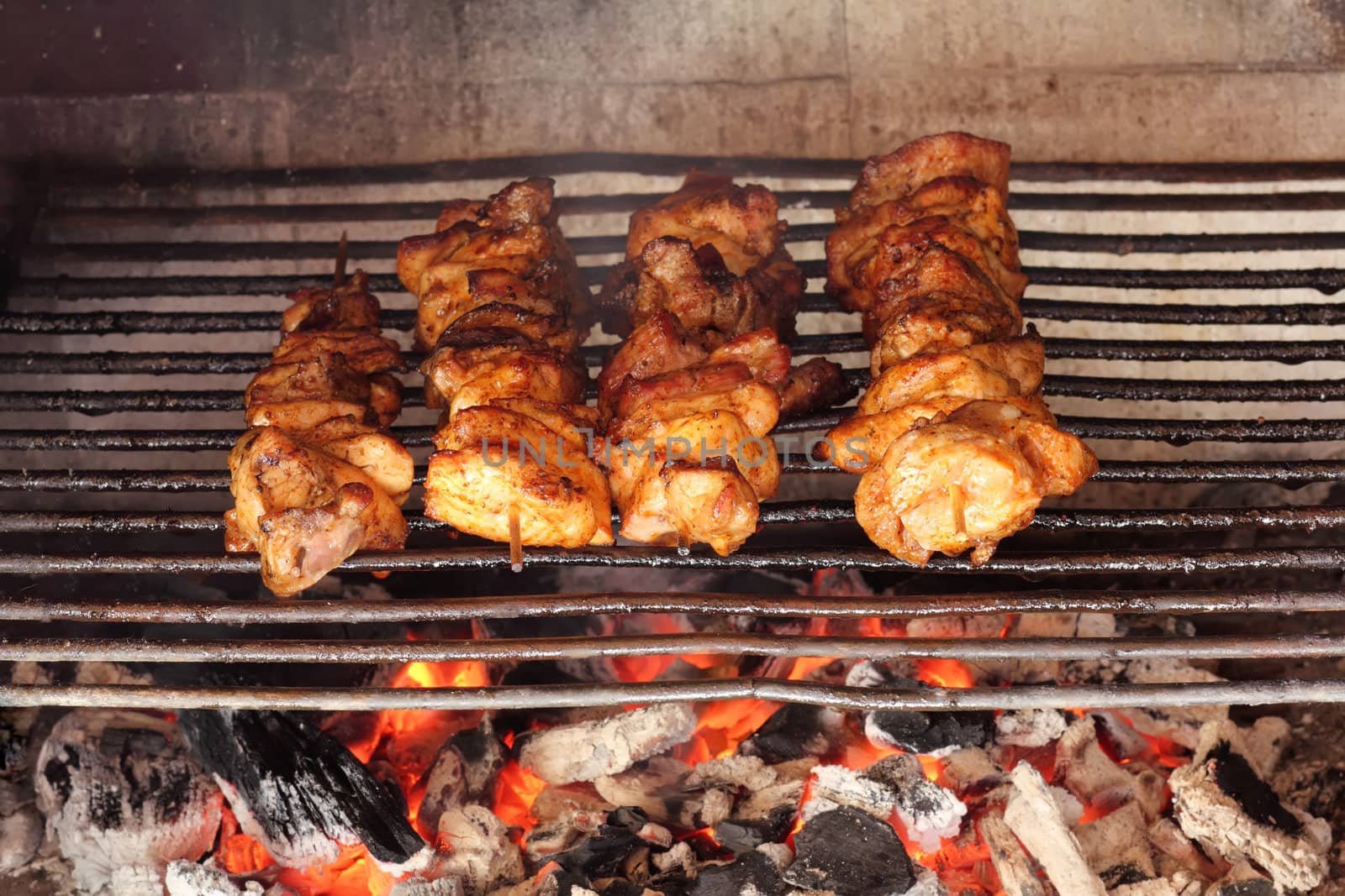 four roasted tasty meat on garden grill