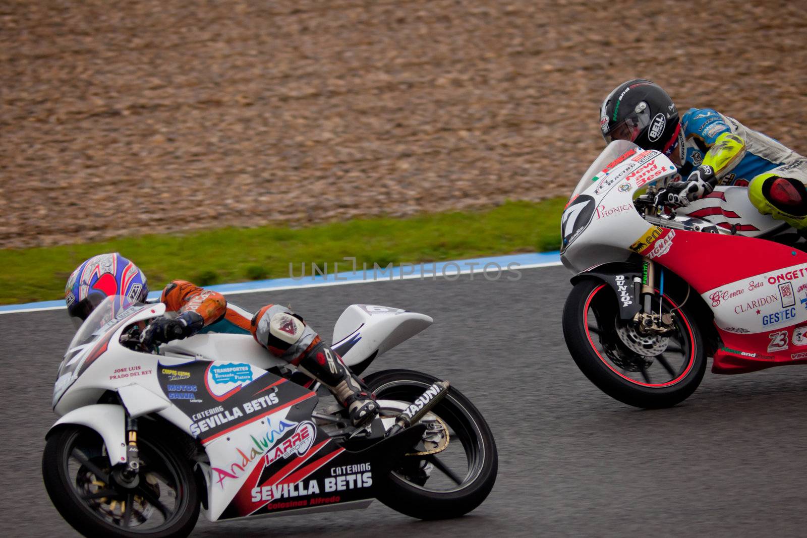 JEREZ DE LA FRONTERA, SPAIN - NOV 20: Pilots Manuel Tatasciore and  Cristobal Tejero of motorcycling of 125cc in the Spanish championship of velocity (CEV) on Nov 20, 2010, in racetrack of velocity of Jerez de la Frontera