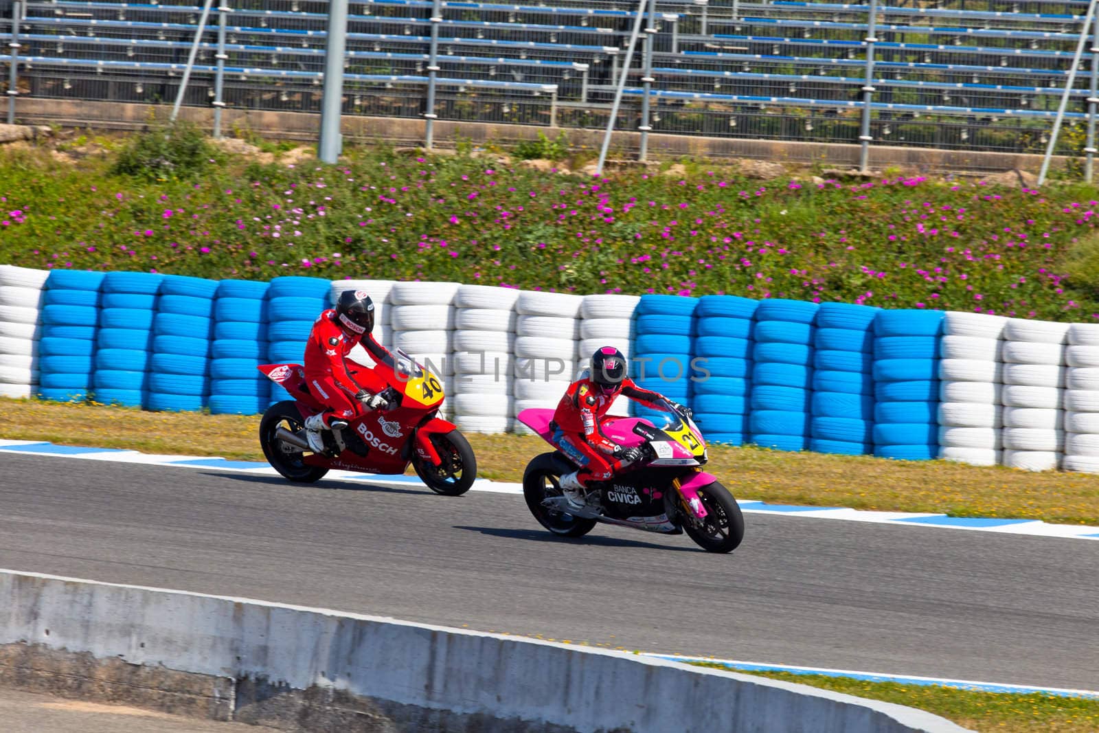 JEREZ DE LA FRONTERA, SPAIN - APR 17: Ivan Moreno pilot of motorcycling of Moto2 taking a curve following by Roman Ramos in the CEV Championship on April 17, 2011, in Jerez de la Frontera