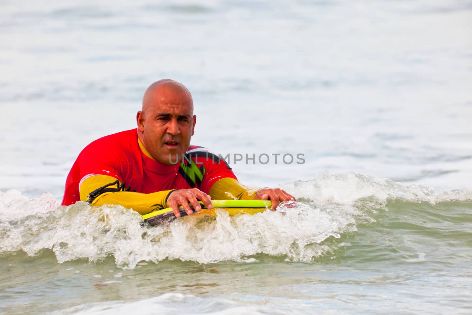 SAN FERNANDO, CADIZ, SPAIN - FEB 19: Unknown bodyboader on the 2nd championship of Surf and BodyBoard Impoxibol on Feb 19,2011 on the beach of Camposoto of San Fernando, Cadiz, Spain