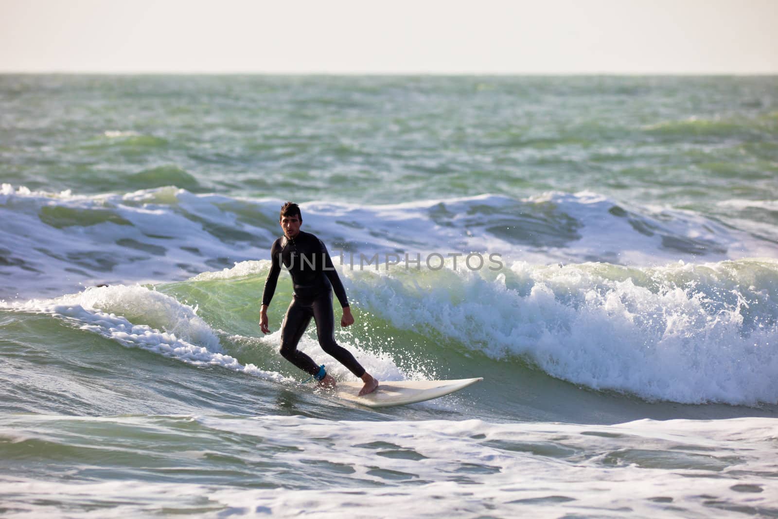 SAN FERNANDO, CADIZ, SPAIN - FEB 19: Unknown surfer on the 2nd championship of Surf and BodyBoard Impoxibol on Feb 19,2011 on the beach of Camposoto of San Fernando, Cadiz, Spain