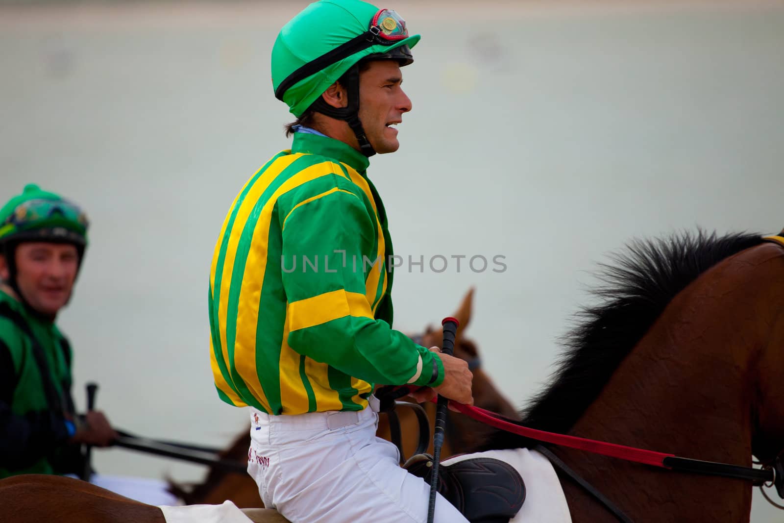 SANLUCAR DE BARRAMEDA, CADIZ, SPAIN - AUGUST 07: Horses races on August 07, 2010 on the beach of Sanlucar de Barrameda, Cadiz, Spain. The races of Sanlucar de Barrameda  are one of the most important horses races of the world