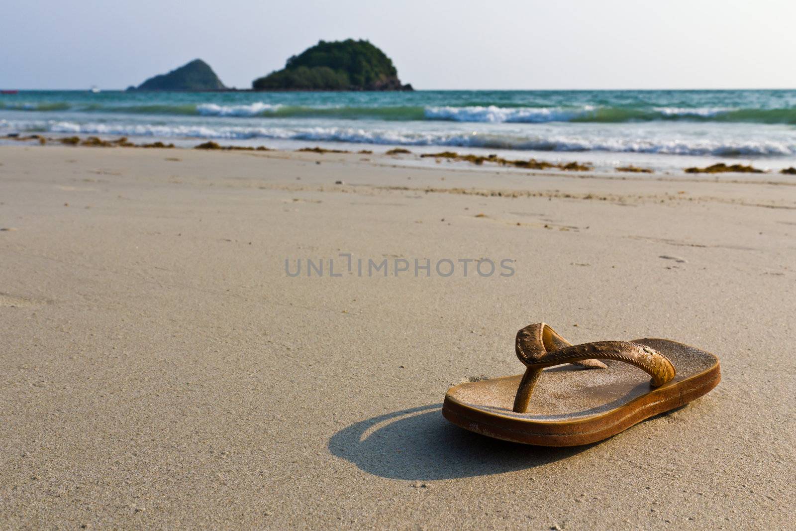  flip-flops on the beach by stoonn