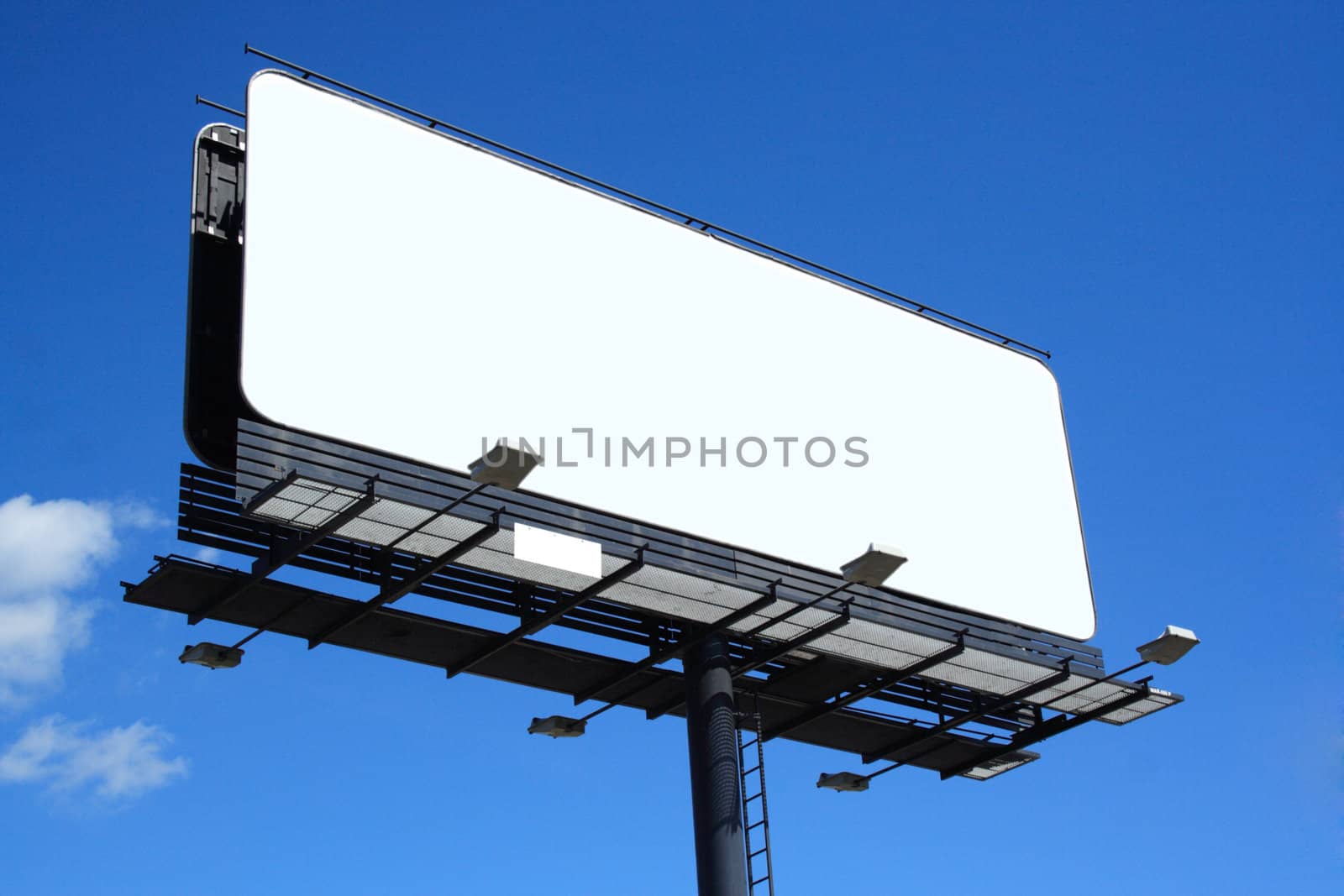 empty billboard on background of blue sky