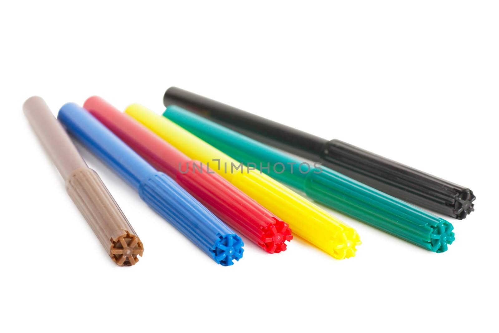 Six colorful markers (brown, blue, red, yellow, green and black) over white background