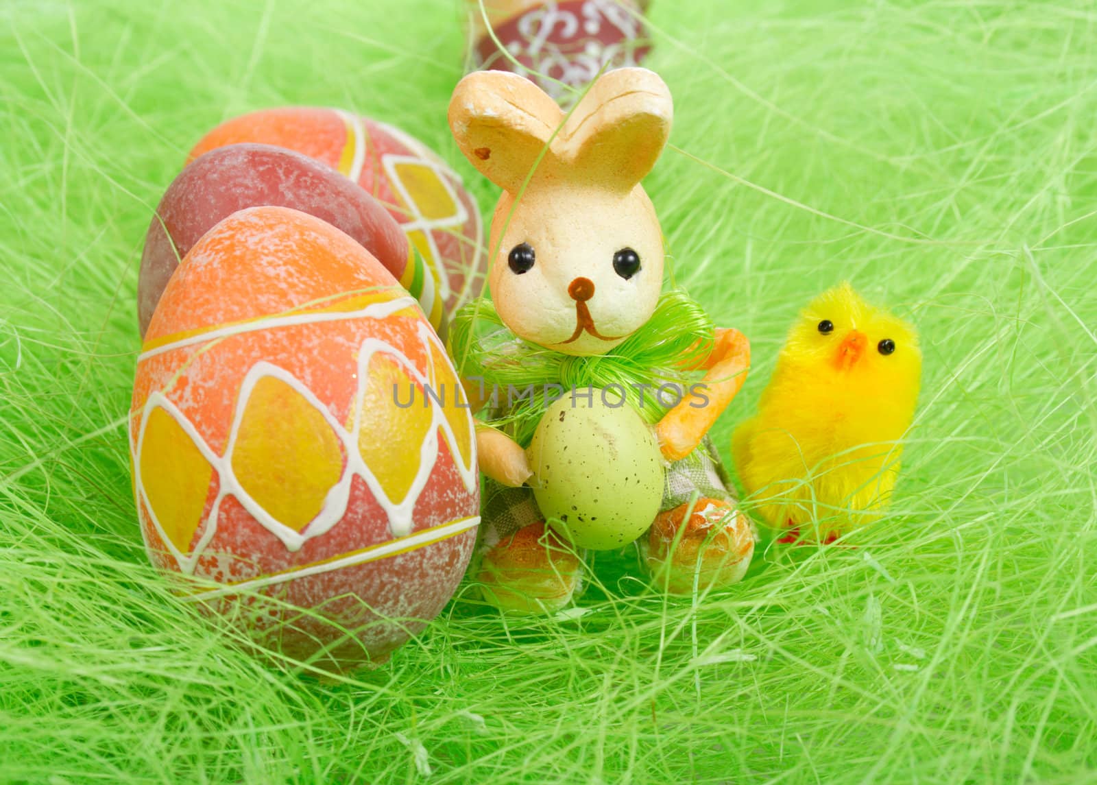 Easter bunny and chick Painted brown Eggs on green Grass