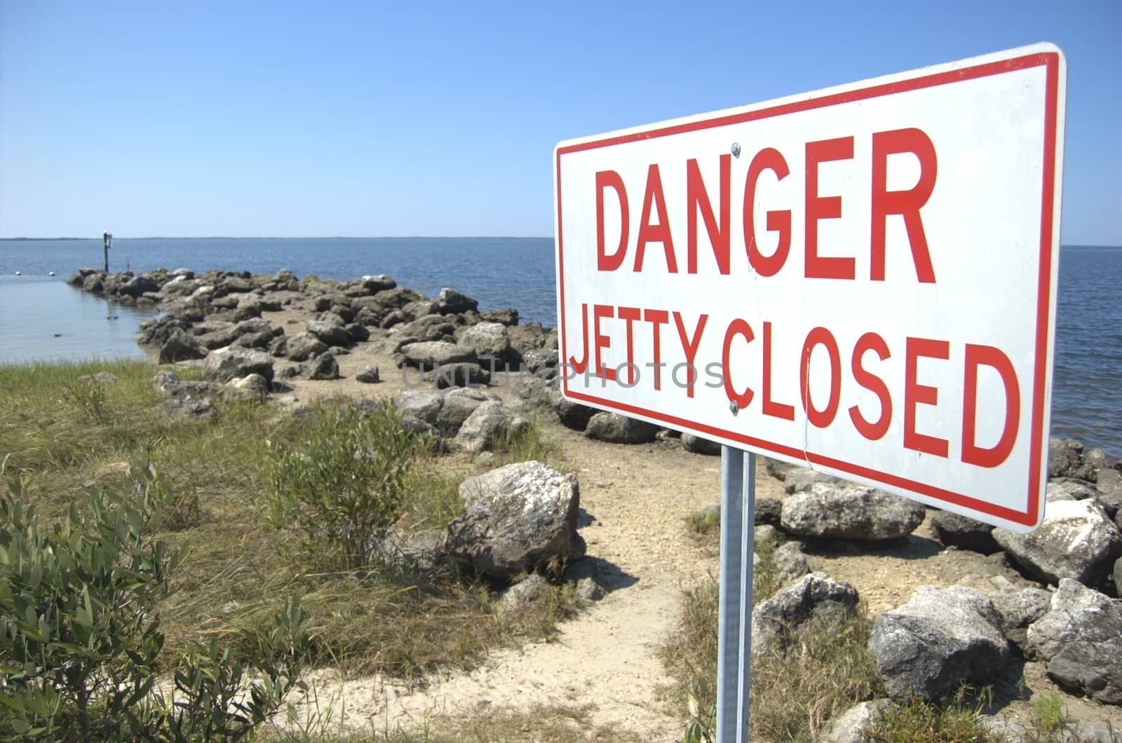 Closed jetty sign in the gulf of Mexico,  Florida 