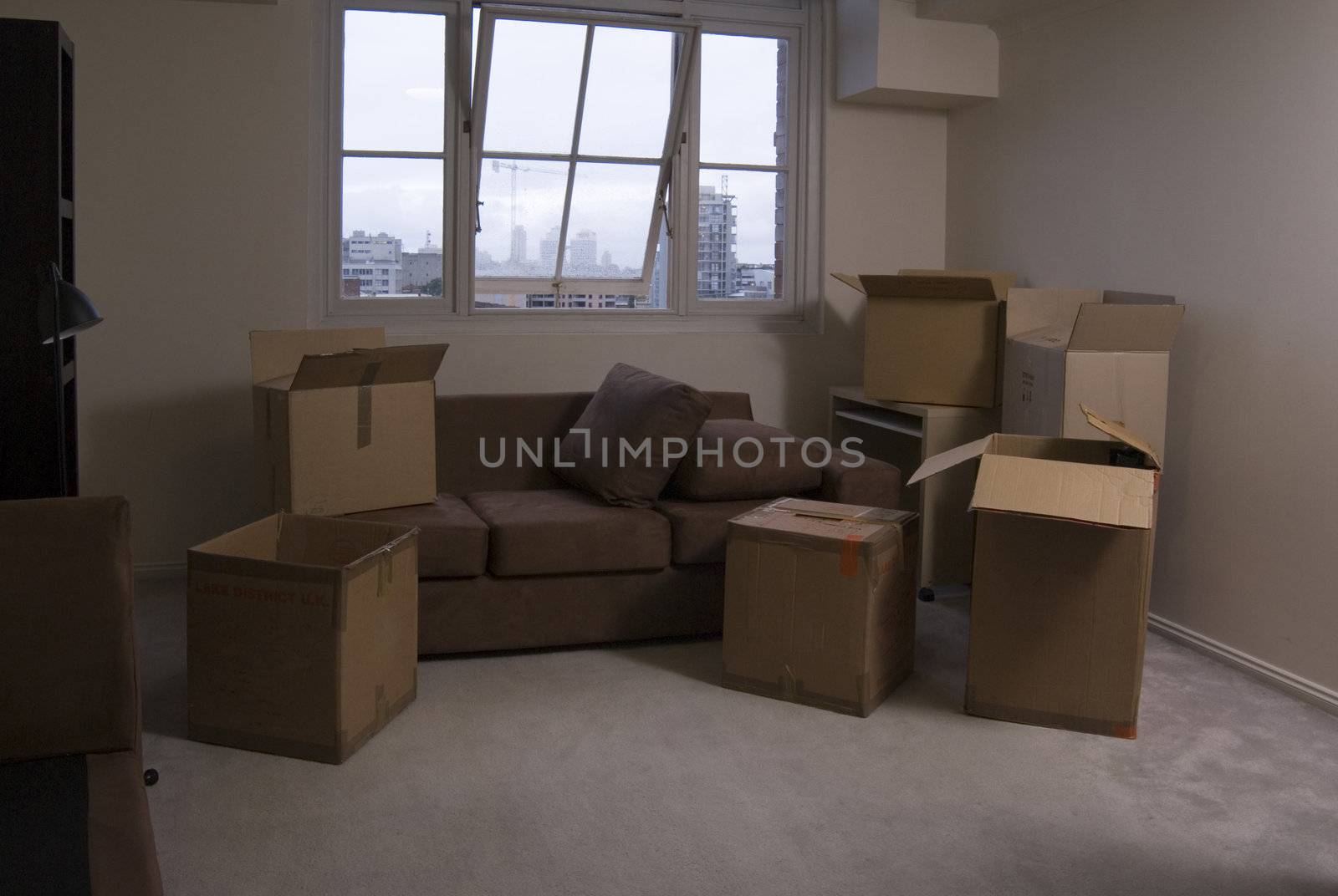 unpacking boxes after moving into a new apartment