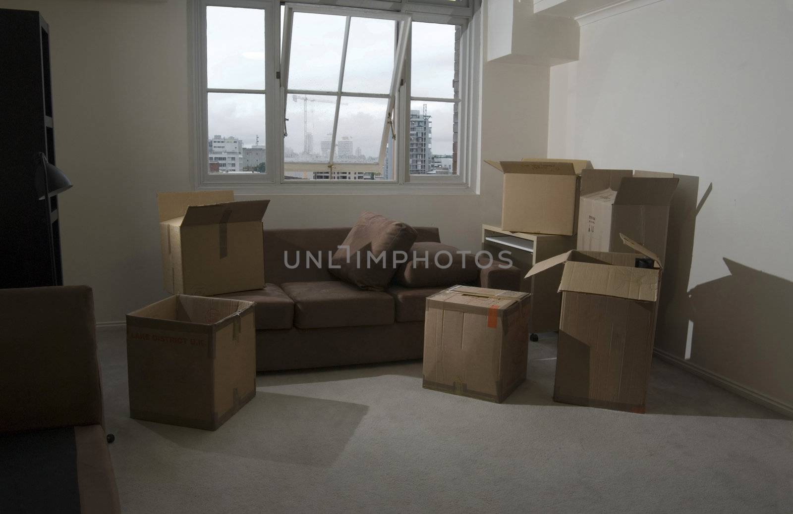 unpacking boxes after moving into a new apartment