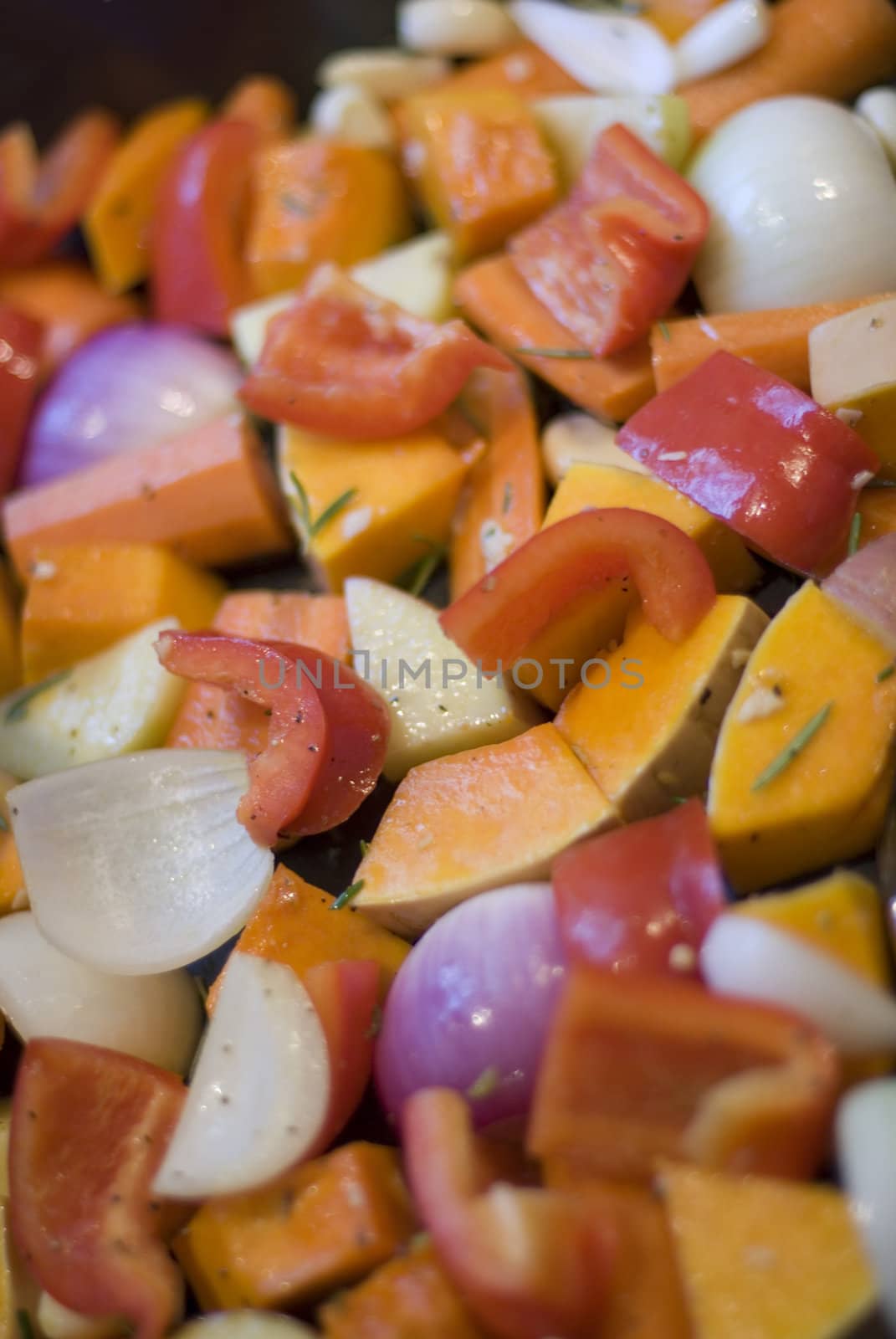 a tray of colourful vegetables ready for roasting