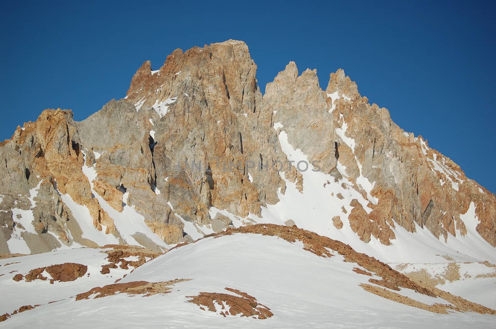 Snow-covered mountain tops with deep blue sky in Patagonia winter resorts