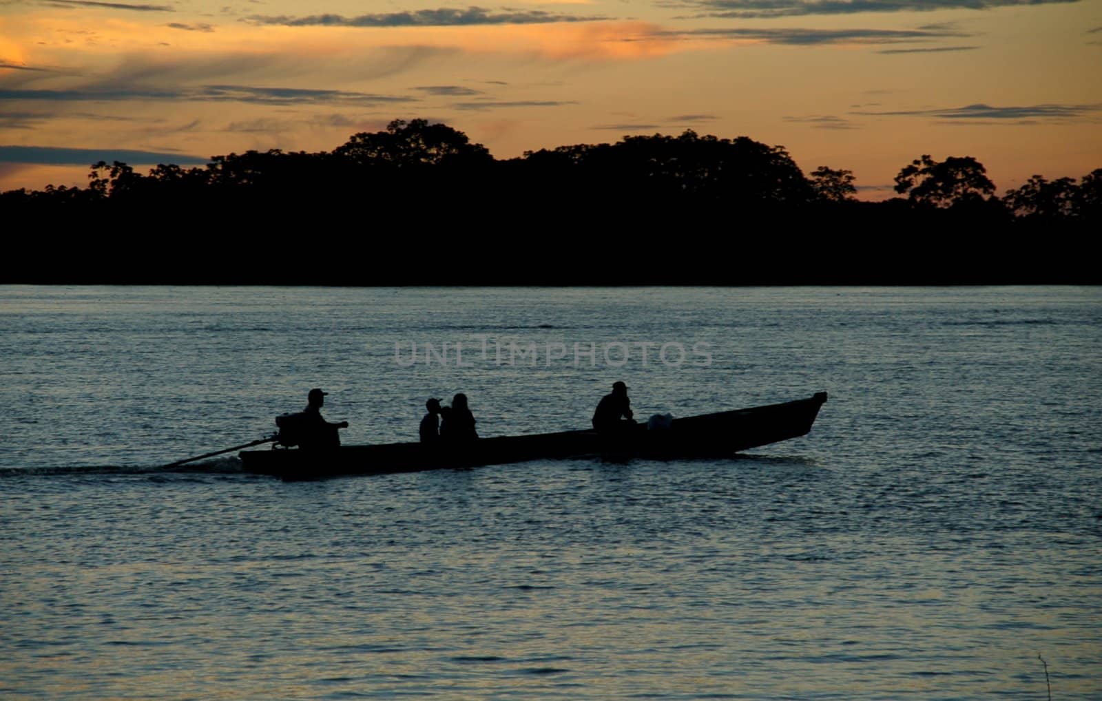 Early morning boat leaving to catch fish in Amazon