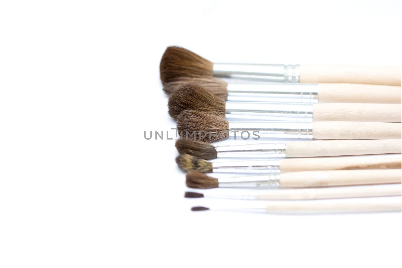 Different thickness proffesional brushes on white background