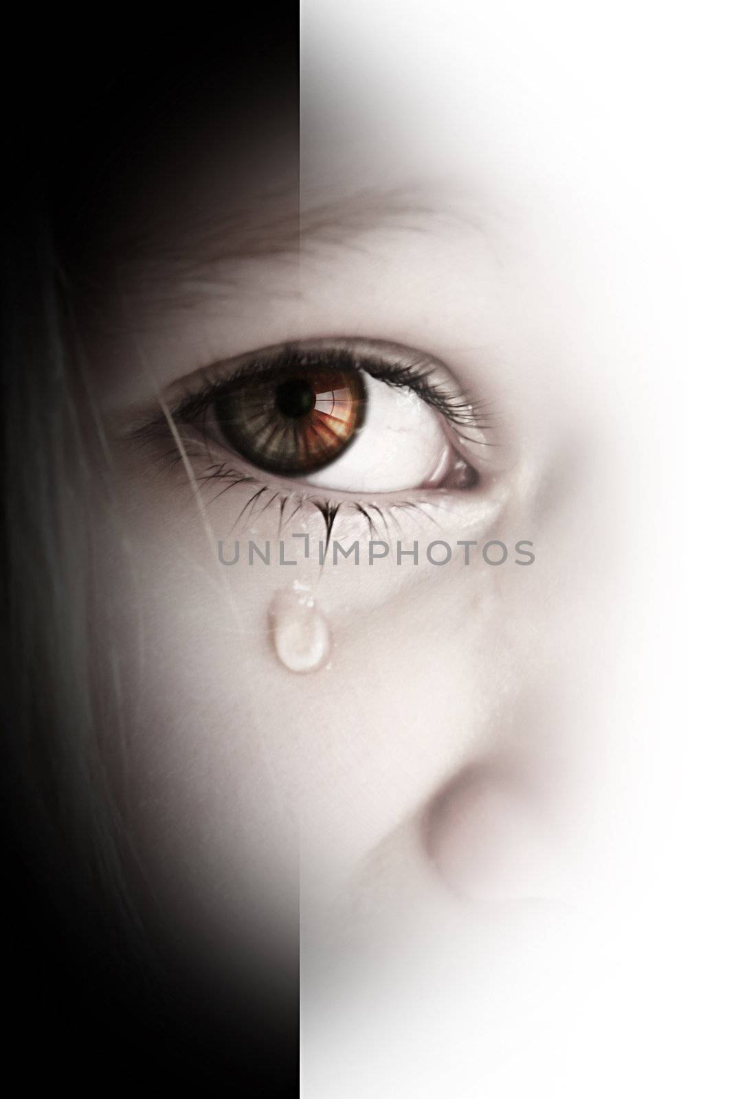 Little sad girl with tears in her eyes