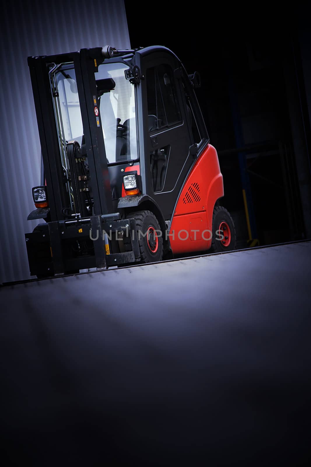 the red forklift in a logistic warehouse with