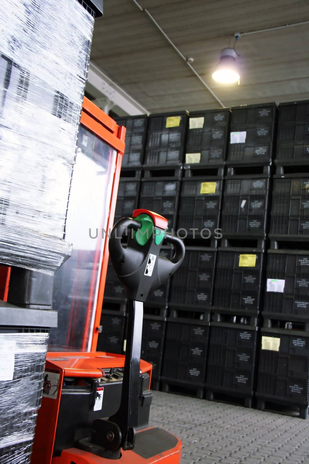 the red forklift in a logistic warehouse with