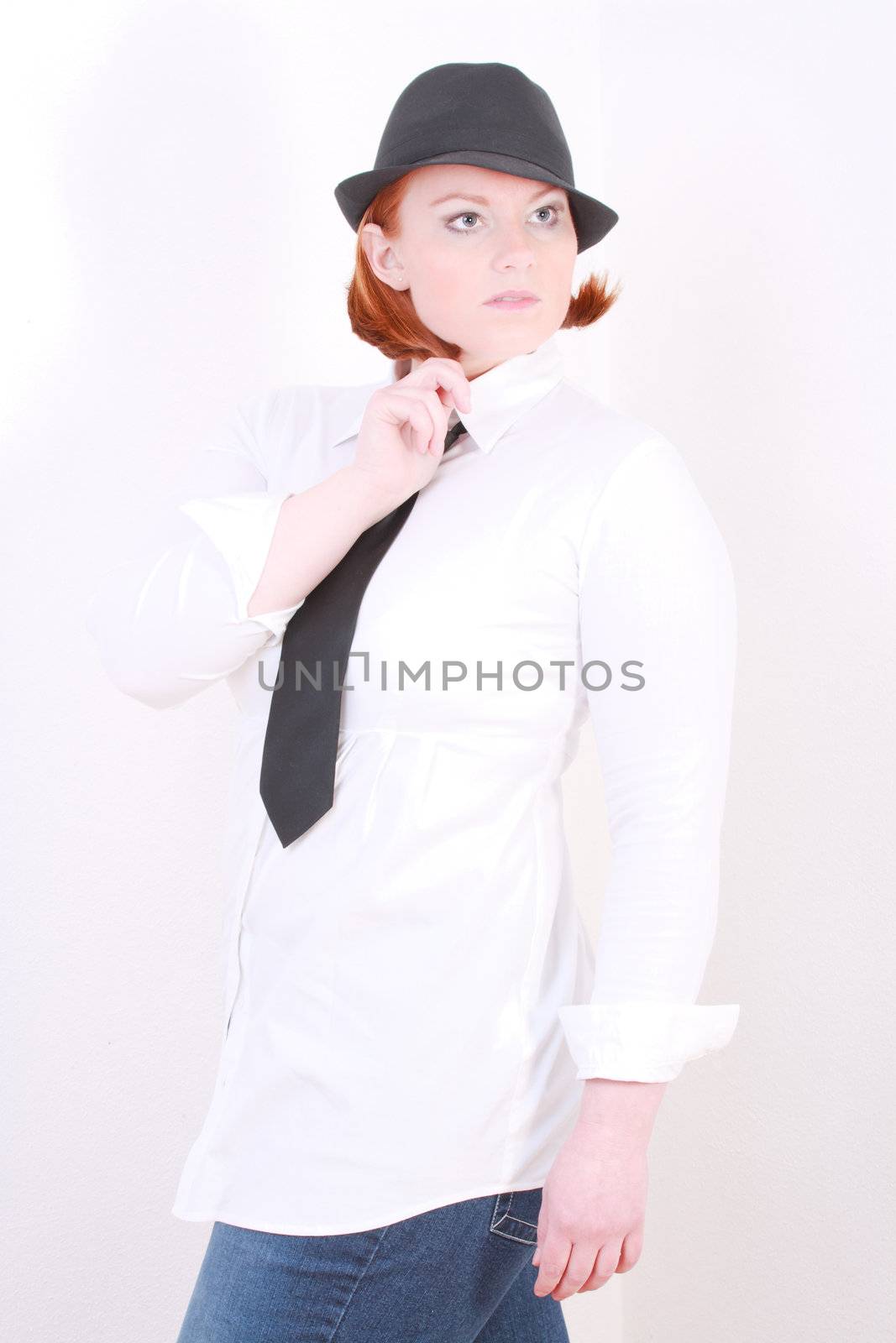 Plus Size Model in white blouse with tie and hat