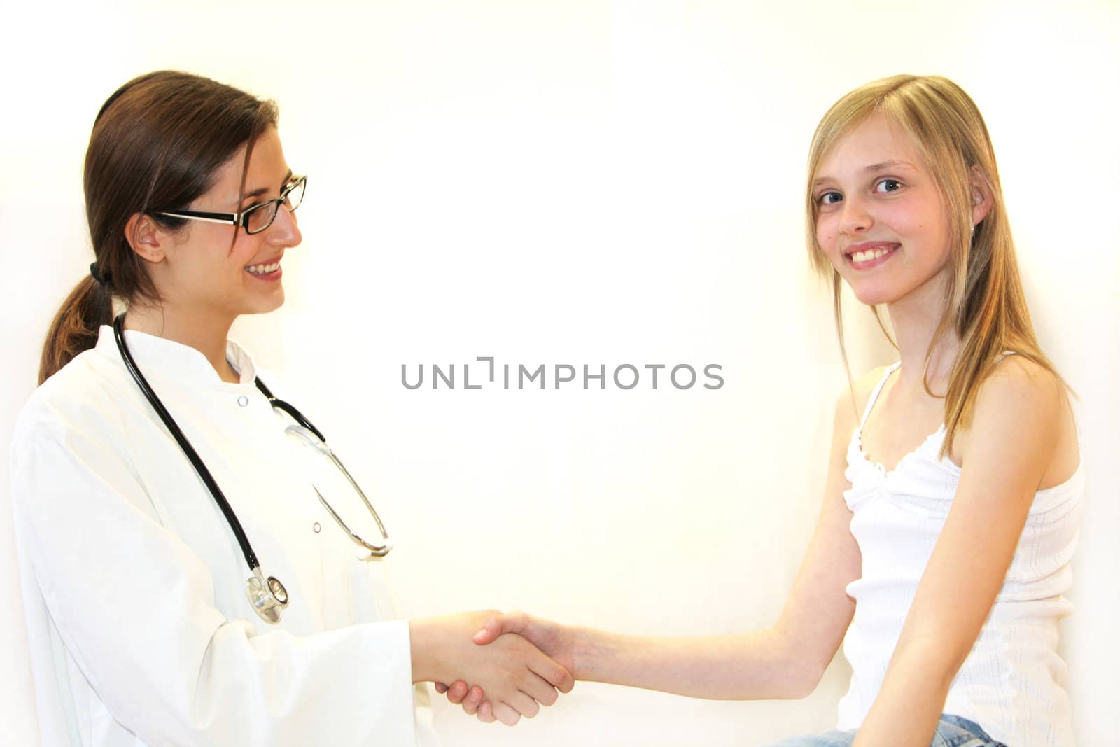Girl with doctor shaking hands - both smiling-Copy Space and white background