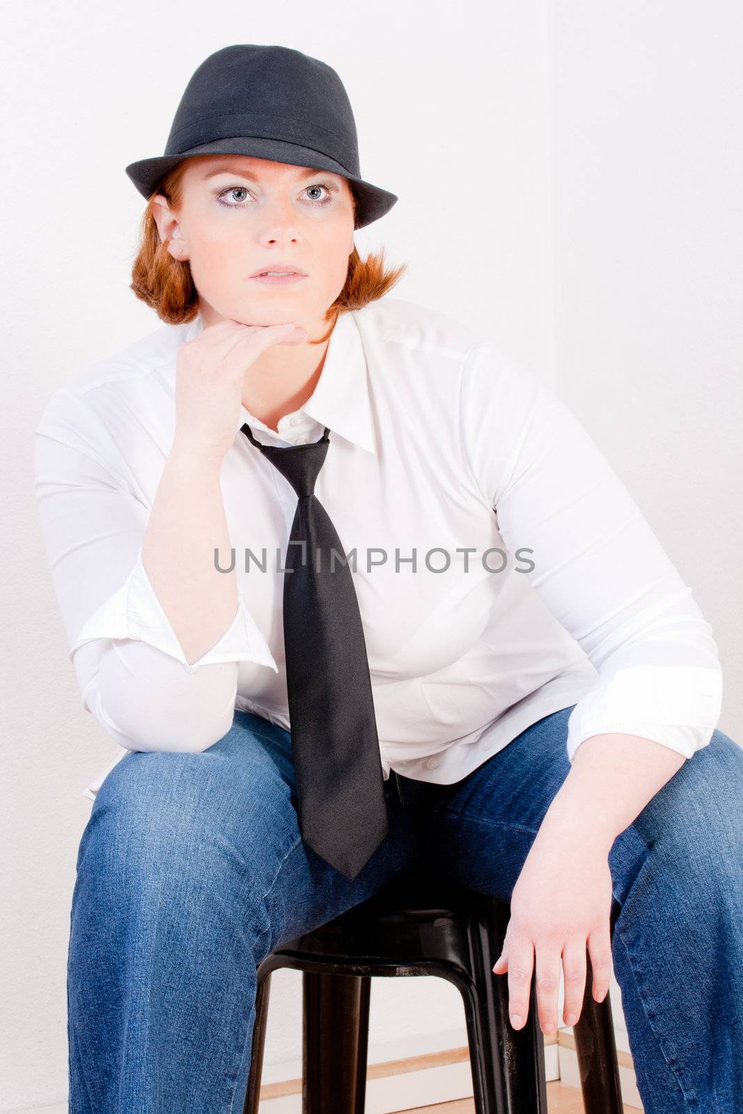 Fashionable Plus Size Model with a hat and tie