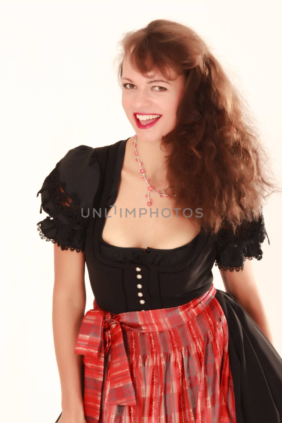 Young smiling girl in traditional Bavarian costume